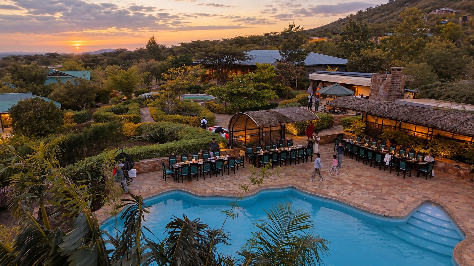 Sausage Tree from above at dusk, with the pool and dining terrace