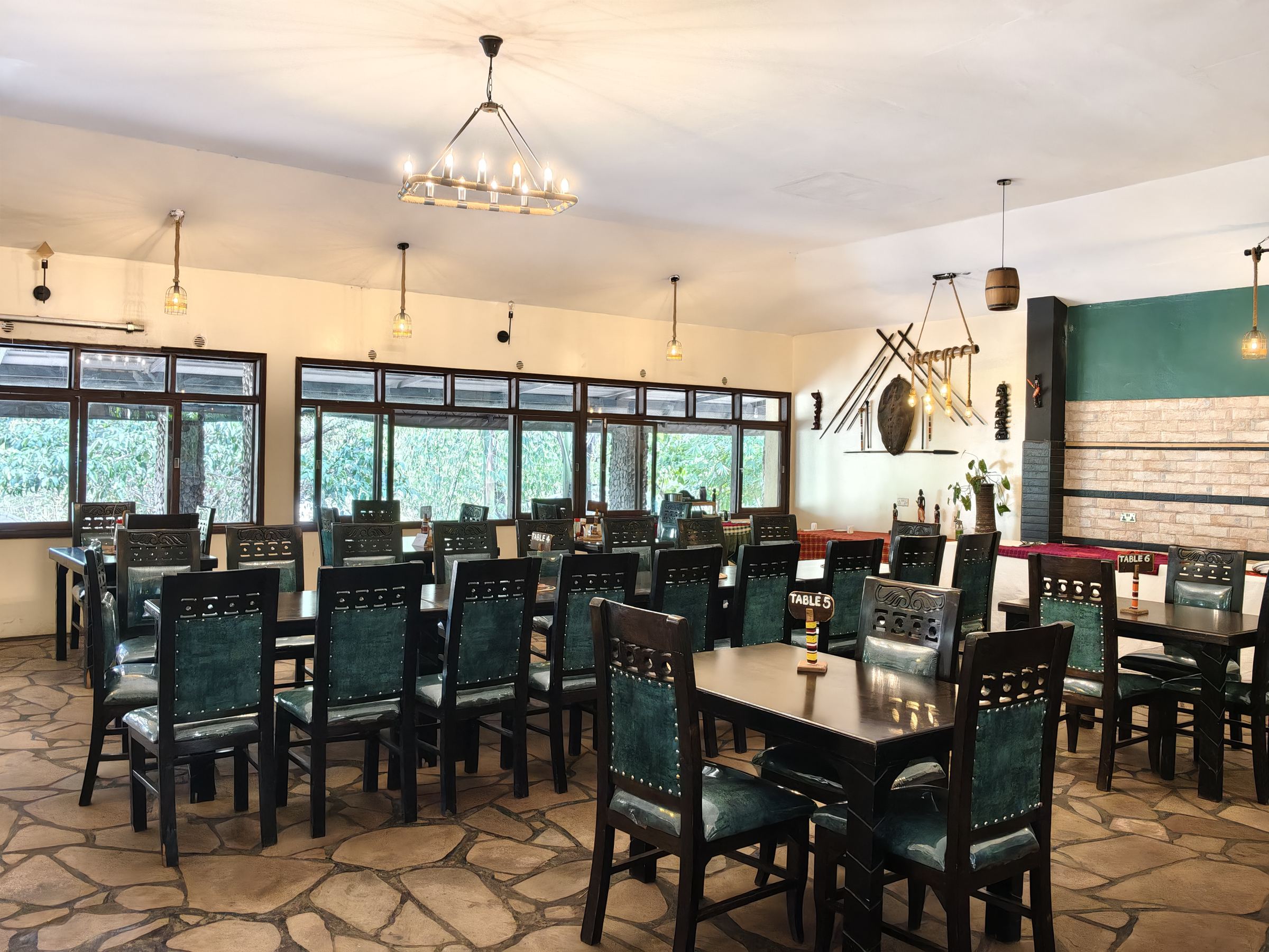Long dining tables set in the Sausage Tree restaurant